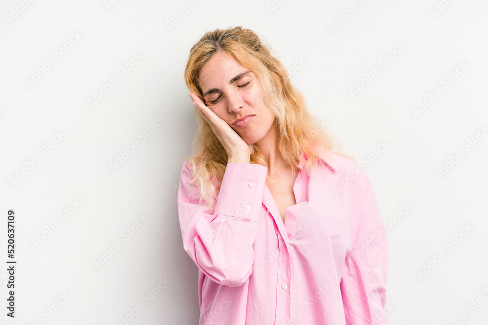 Young caucasian woman isolated on white background who is bored, fatigued and need a relax day. Young caucasian woman isolated on white background who is bored, fatigued and need a relax day.