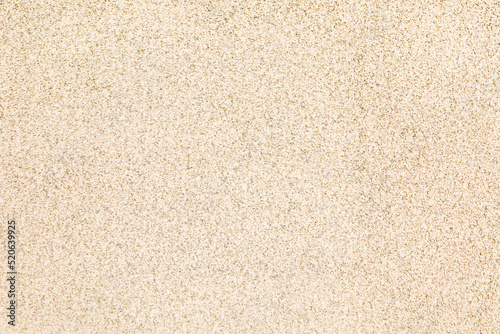 Texture of beige plaster wall as background photo