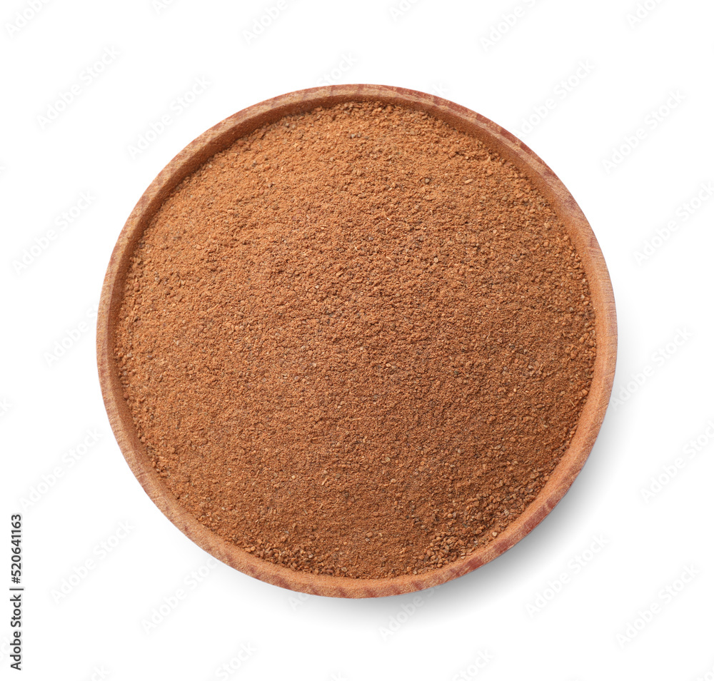 Wooden bowl with aromatic cinnamon powder isolated on white Wooden bowl with aromatic cinnamon powder isolated on white