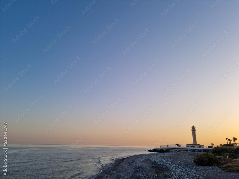 Landscape view of the torrox lighthouse and the mediterranean sea Landscape view of the torrox lighthouse and the mediterranean sea