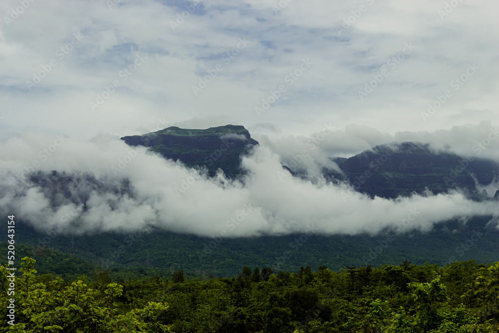The Beautiful View of Sahyadri Mountain Range, Clouds Touching Hills and Hut Near The Hill, 
