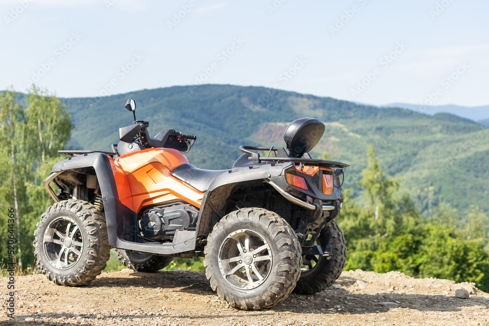 ATV Quad Bike in front of mountains landscape. ATV Quad Bike in front of mountains landscape.