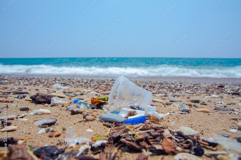 A man-made garbage in the sea: plastic bottles, glasses and other plastic. A man-made garbage in the sea: plastic bottles, glasses and other plastic.