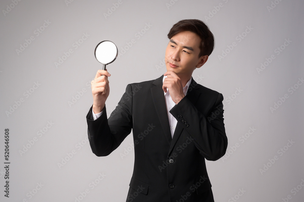 Young businessman wearing suit over white background studio Young businessman wearing suit over white background studio