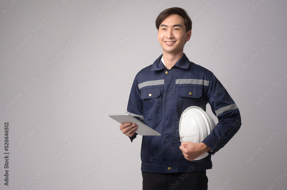Portrait of male engineer wearing a protective helmet over white background studio. Portrait of male engineer wearing a protective helmet over white background studio.