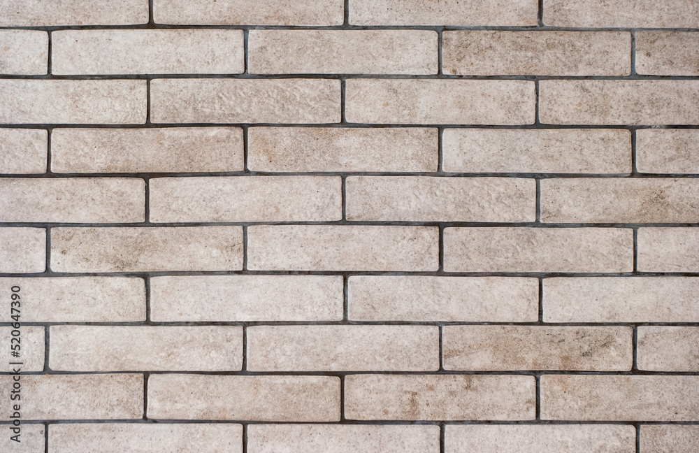 Background of a wall of gray and dirty bricks close-up Background of a wall of gray and dirty bricks close-up