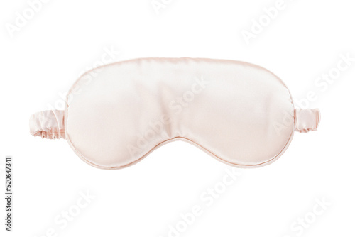 Pink satin eye sleeping mask isolated on white background. Insomnia and sleeplessness disorder concept. Close up, copy space, flat lay. Accessories for girls and women photo