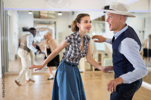 Photography Man and woman performing jazz dance in dancing room