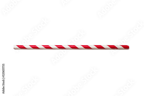 A red and white drinking straw is located on a white background. The concept of a children's holiday or party. A handy drinking accessory. Eco-friendly paper straw for drinking beverages