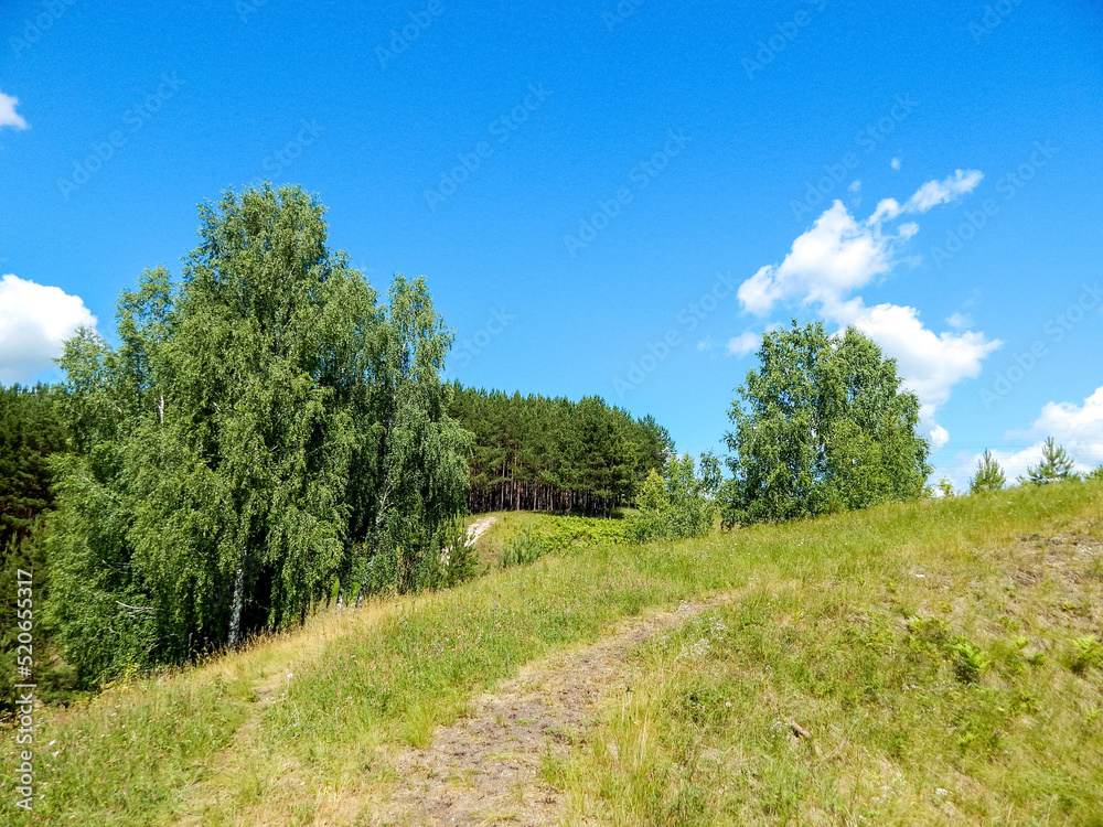 Landscape with hills and blue sky