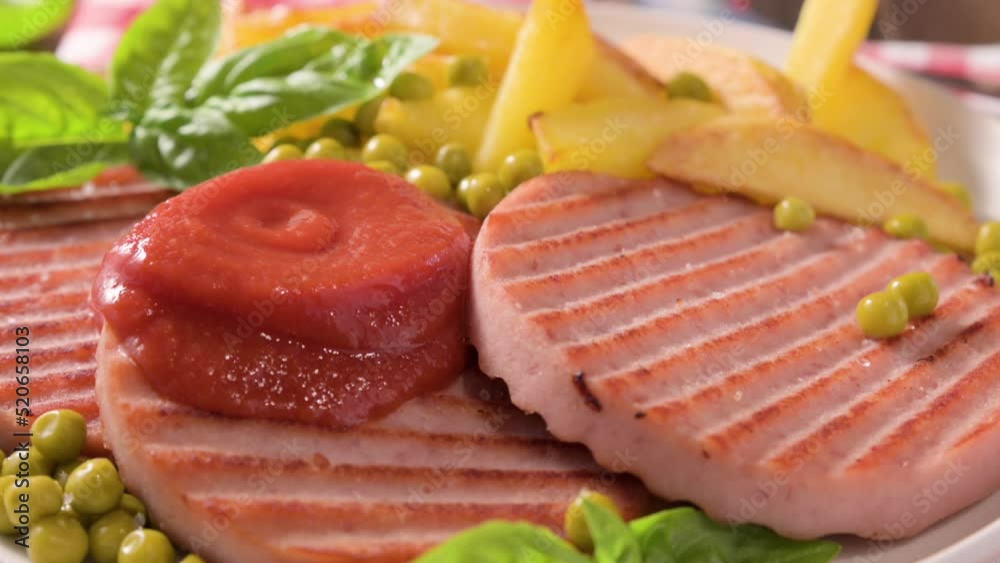 TENERONI WITH COOKED HAM.Soft Italian cutlets with prosciutto cotto, usually prepared for children's meals and snacks. served with potatoes and vegetables with tomato paste or ketchup.4k footage TENERONI WITH COOKED HAM.Soft Italian cutlets with prosciutto cotto, usually prepared for children's meals and snacks. served with potatoes and vegetables with tomato paste or ketchup.4k footage