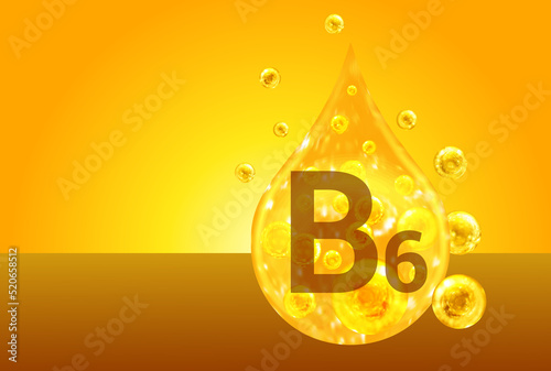 Vitamin B6. Golden drops with oxygen bubbles. Health concept photo