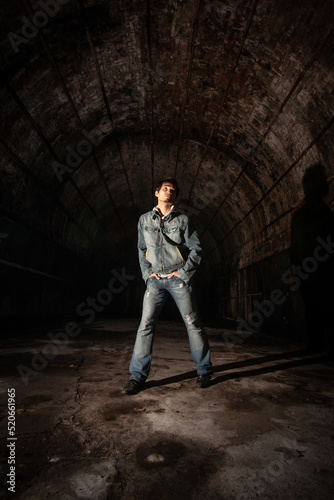 Underground fashion. Vintage urban fashion in an industrial environment with a handsome male Asian model. From a series of images with the same model.