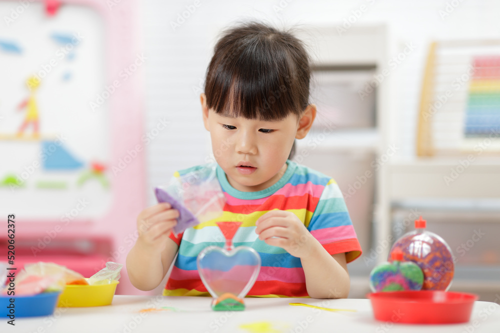 young girl making sand crafts for homeschooling young girl making sand crafts for homeschooling