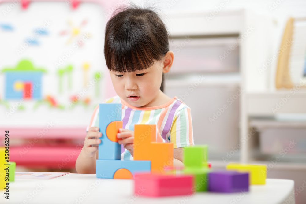 young girl playing creative blocks at home young girl playing creative blocks at home