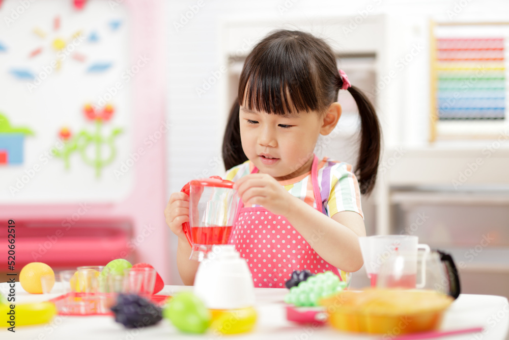 young girl pretend play food preparing at home young girl pretend play food preparing at home