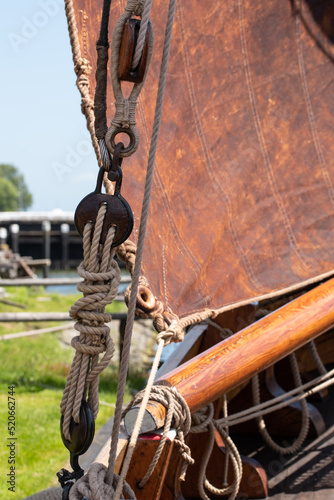 Enkhuizen, Netherlands. June 2022. Close up of rigging of an old flat-bottomed boat.
