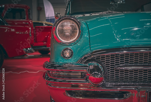 Classic car headlights close-up. The concept of a poster on the wall