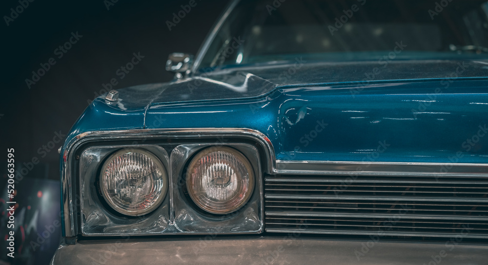 Classic car headlights close-up. The concept of a poster on the wall