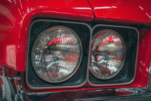 Classic car headlights close-up. The concept of a poster on the wall