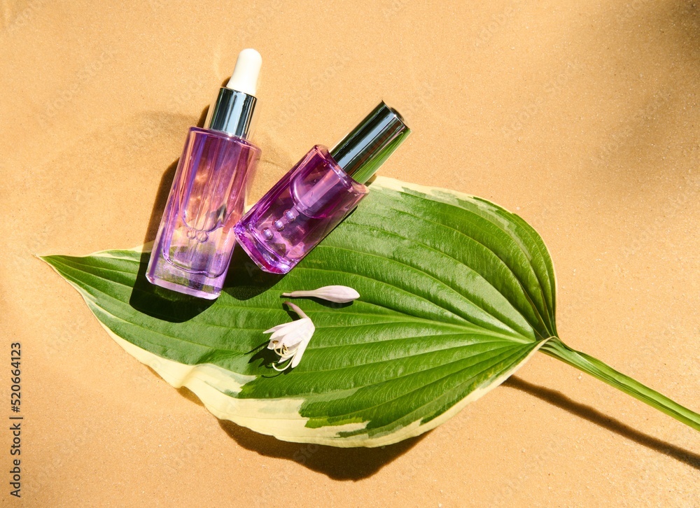 Top view. Antiaging serum, liquid skin care product in glass jars on