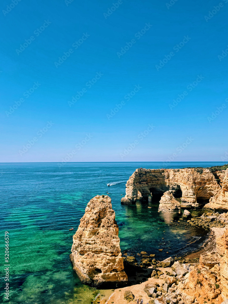 Marinha beach Algarve Portugal. Rocks and caves. Turquoise sea water.
