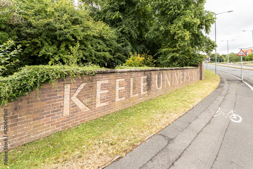 Newcastle-under-Lyme, Staffordshire-united kingdom April, 14, 2022 keele university main roadway entrance with brick wall and built in name