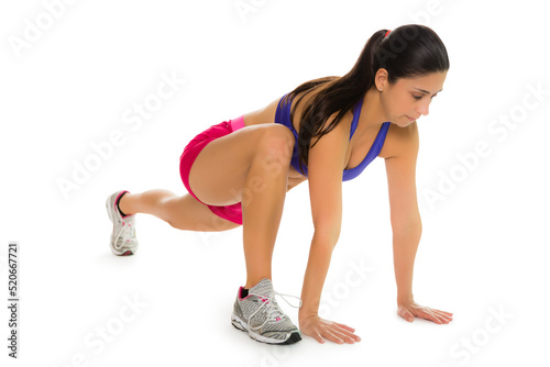 Hispanic female in runner's lunge, copy space