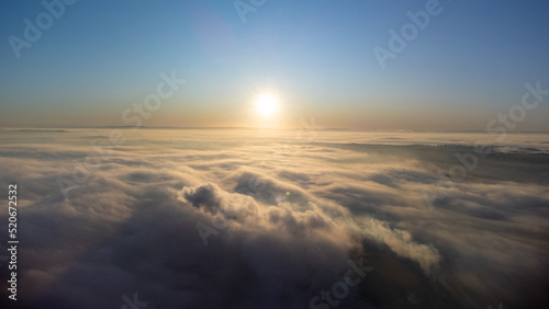 Sunrise, sunrise over a thick layer of fog in a small town in Brazil, drone photo.