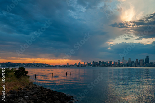 Seattle Skyline During the Morning Blue Hour Seen From West Seattle.  Dynamic view of the Seattle cityscape just before dawn with Elliott Bay in the foreground and the waterfront in the distance.  © LoweStock