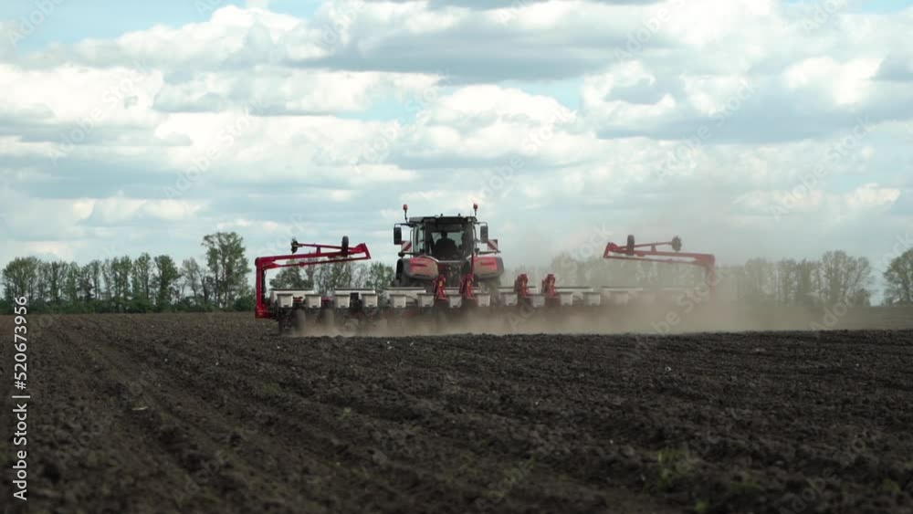 tractor works in the field. sowing corn. precision farming. tractor works in the field. sowing corn. precision farming.