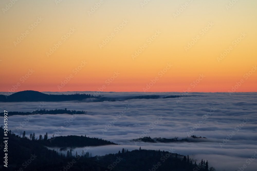 sunset in the mountains with a sea of fog