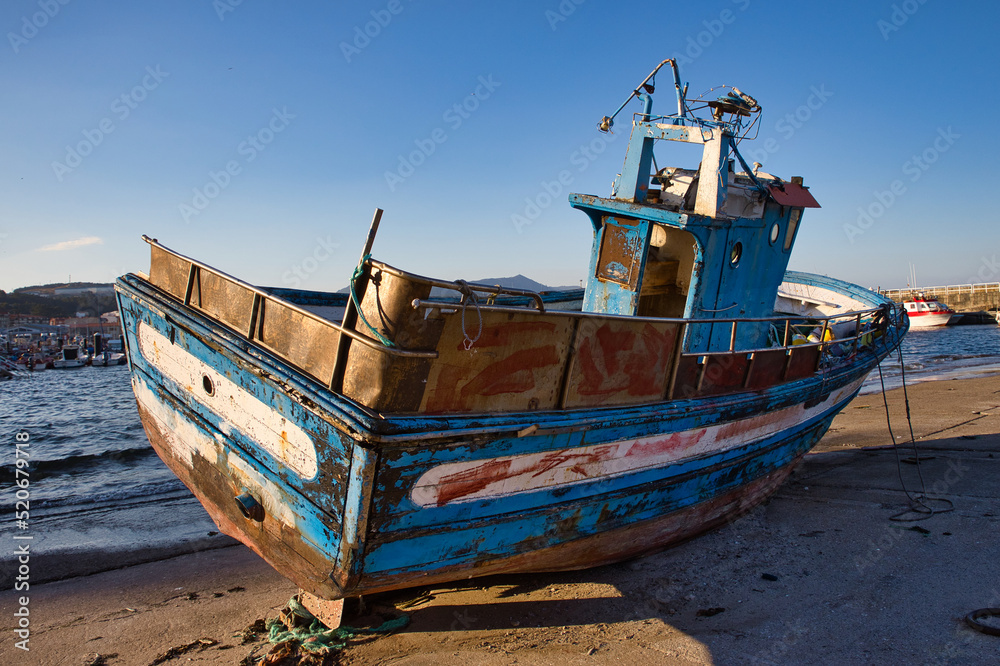 Old wooden boat stranded