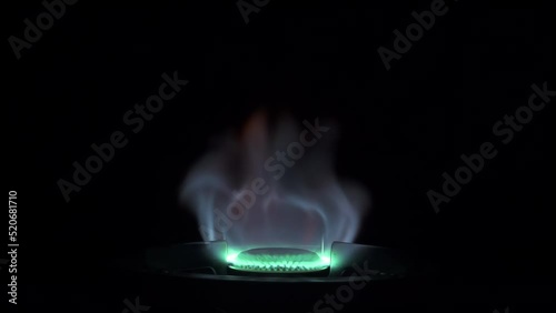 Gas burning flames of the stove isolated on Black Background. shot with 120fps and conformed to 30fps slow-motion. photo