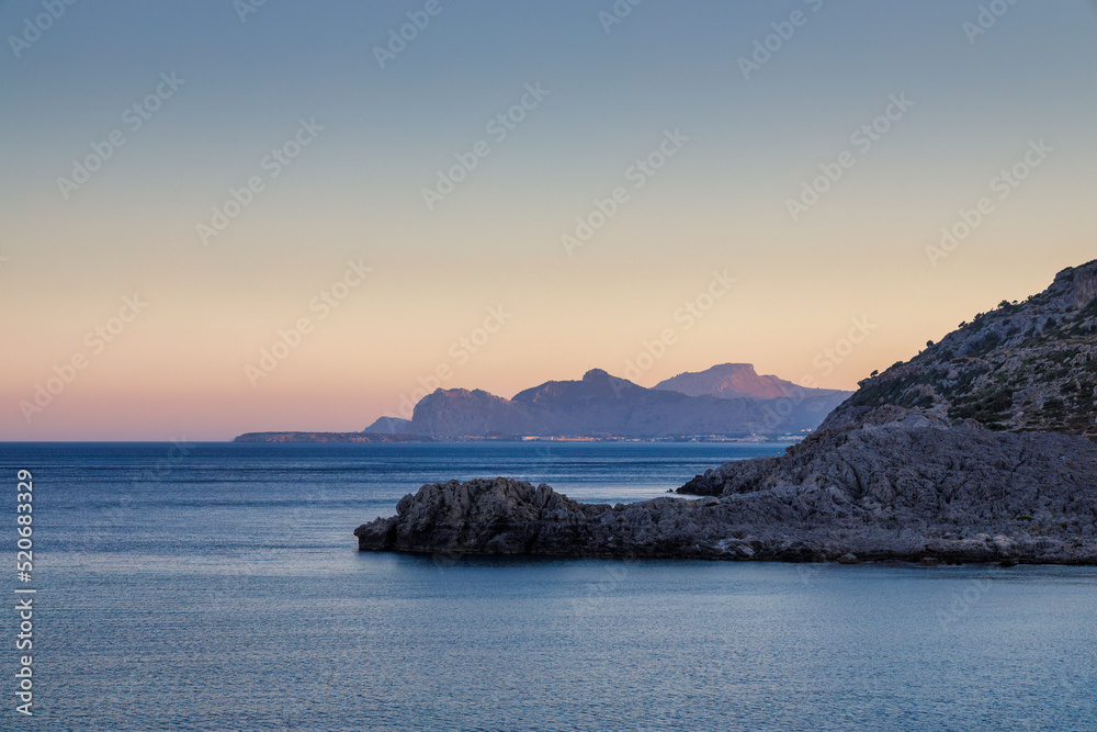 A view of the east coast of the island of Rhodes at sunset, Greece, Europe.