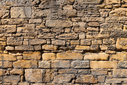 1 August 2022, Bishopmill, Elgin, Moray, Scotland. This is a Moray Sandstone wall in Bishopmill on a sunny day.