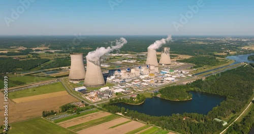 Aerial view to nuclear power plant in France. Atomic power stations are very important sources of electricity with low carbon footprint. Aerial view to big source of emissions in European Union