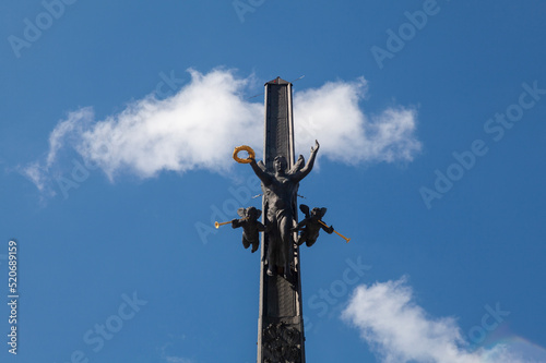 Victory Monument in Moscow against a blue sky with white clouds