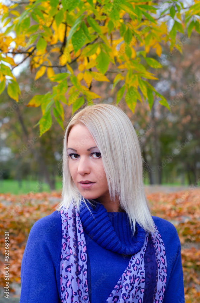 Young woman walking in the autumn nature on a rainy day Young woman walking in the autumn nature on a rainy day