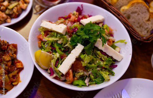 Light vegetable salad Choban with cheese in a Turkish cafe.