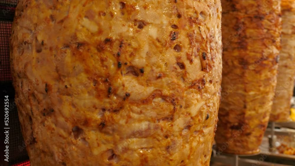 Traditional spinning spit of doner kebab meat in Turkish street snack bar Traditional spinning spit of doner kebab meat in Turkish street snack bar