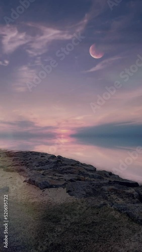 Vertical video of moon over the sea