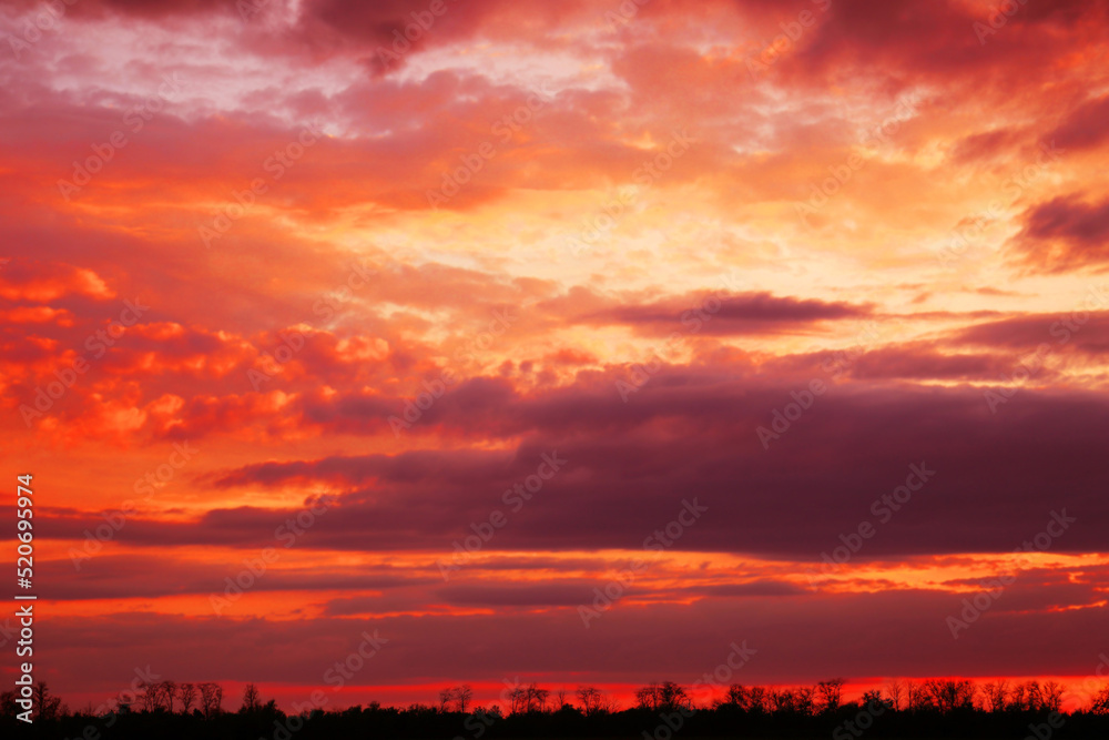 Beautiful view of orange sky with clouds at sunset Beautiful view of orange sky with clouds at sunset