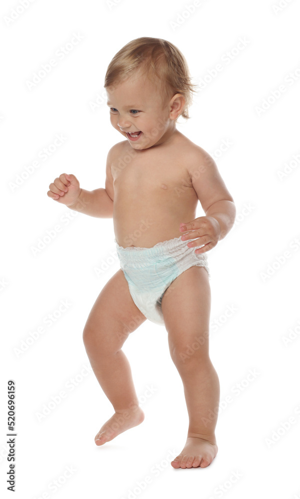 Cute baby in diaper learning to walk on white background Cute baby in diaper learning to walk on white background