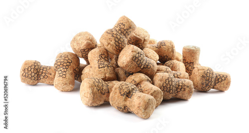 Heap of sparkling wine corks on white background