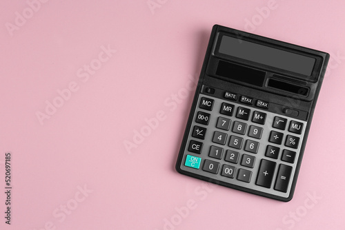 Modern calculator on pink background, top view. Space for text