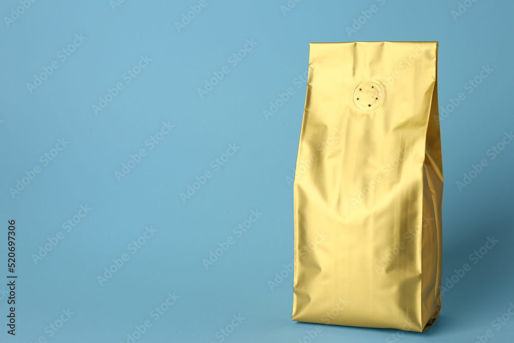 Fototapeta premium One blank foil package on light blue background. Space for text