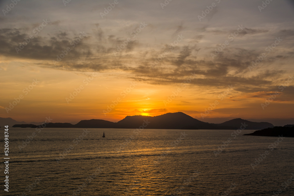 Sunset over the sea at the coast of Angra dos Reis town, State of Rio de Janeiro, Brazil. Photo taken with Nikon D7100, 18-200 lens, at 29mm, 1/125 f 6.3 ISO 100. Date: Dec 28, 2016