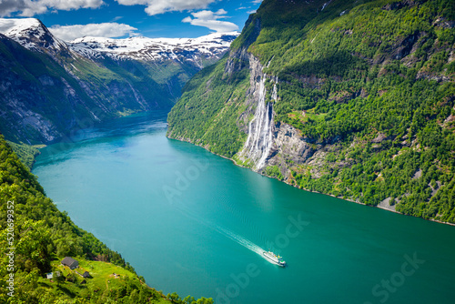 Vászonkép Ferry ship crossing Geirangerfjord and Seven Sisters Waterfalls, Norway