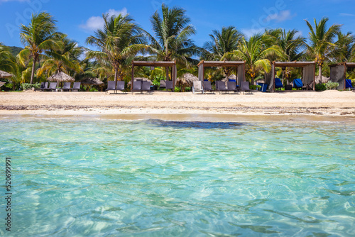 Caribbean beach with gazebo and lounge chairs, Montego Bay, Jamaica